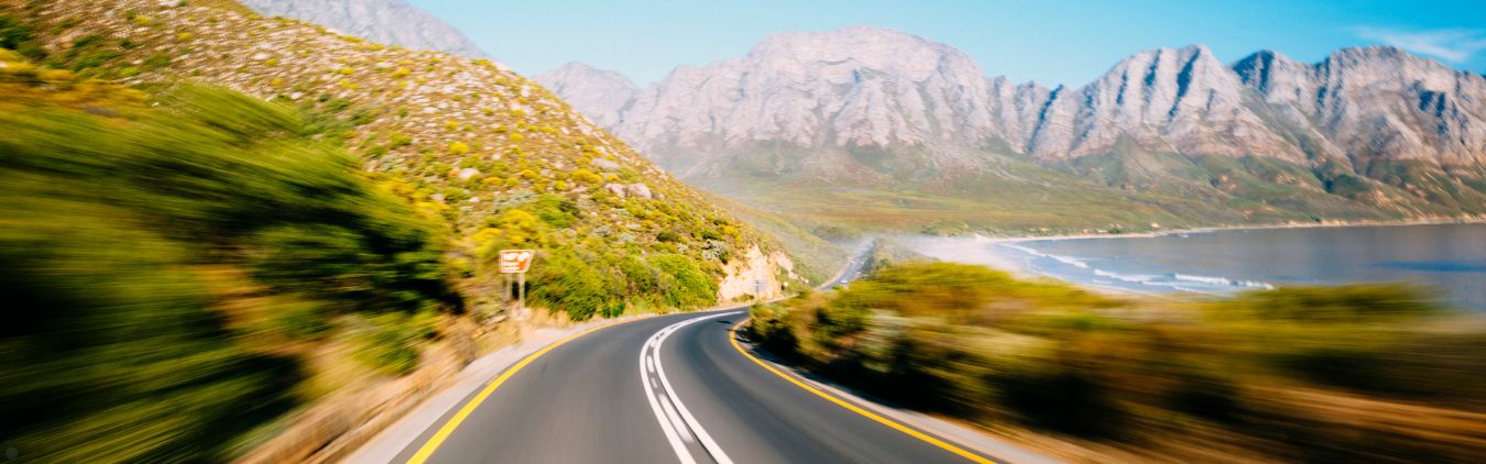 A highway in front of mountains.